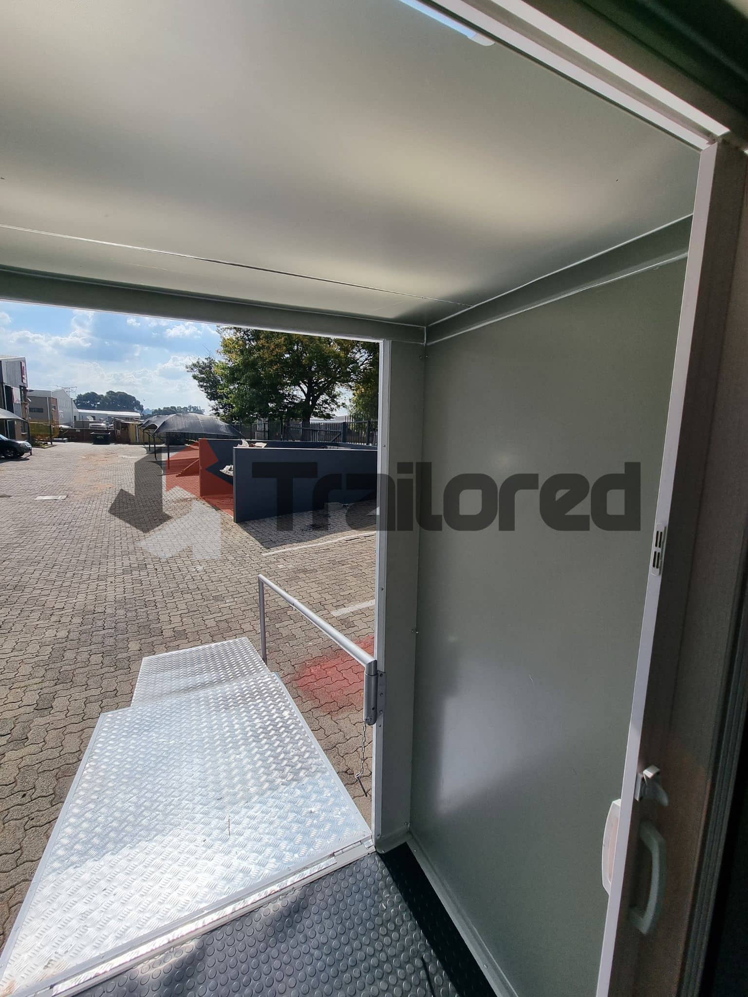 Accessible VIP toilet trailer with ramp deployed