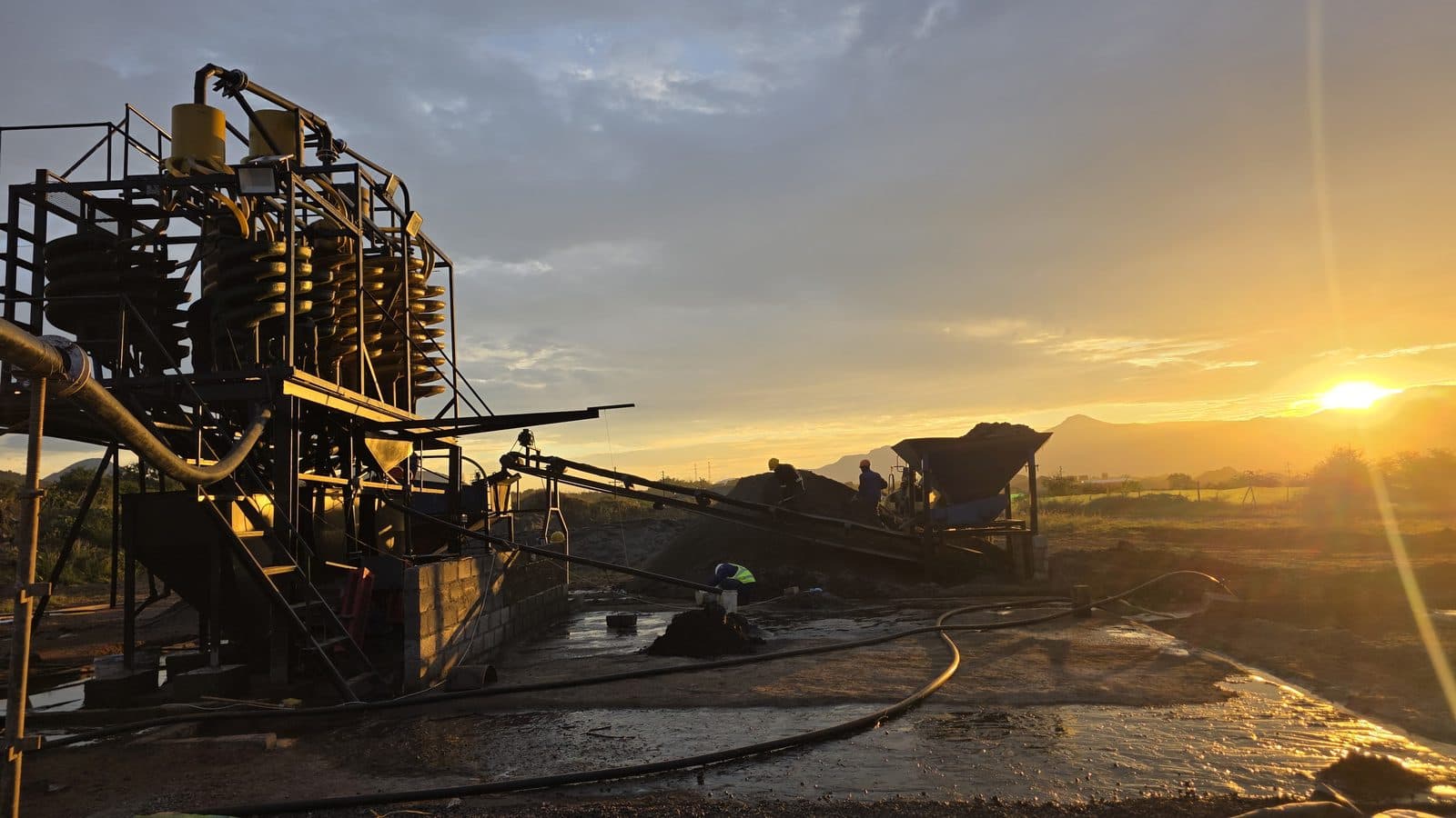 Flow Minerals chrome beneficiation washplant at golden hour, with the spiral support structure and feed bins fabricated by Trailored