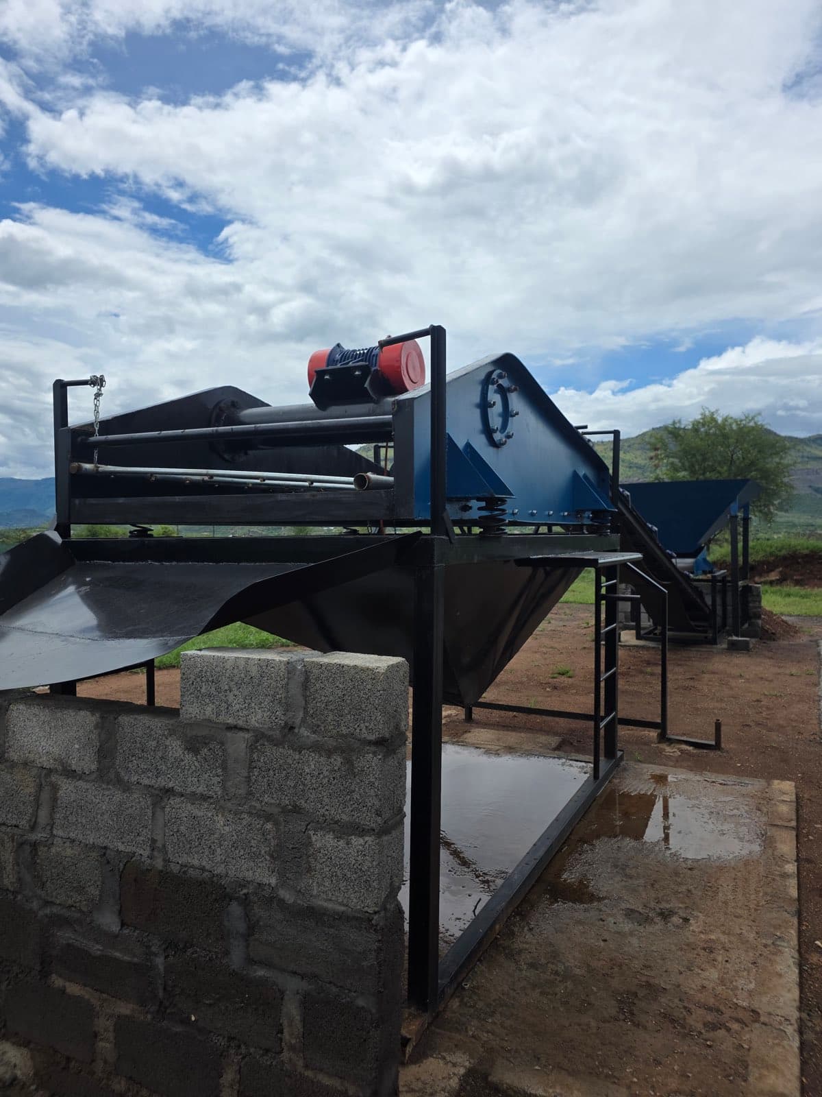 A fabricated dewatering screen and discharge chute on its structural steel support frame at the chrome washplant