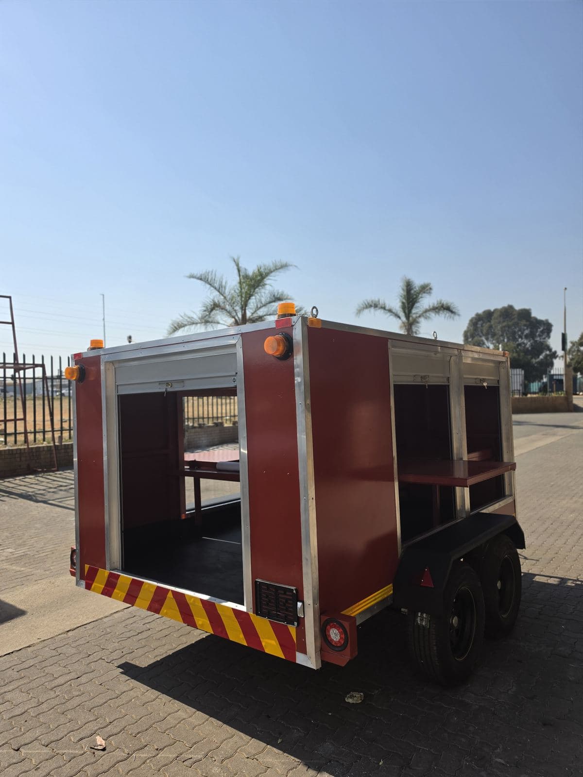 Rear of the hazmat trailer with the chevron board fitted below the rear roller-shutter door.