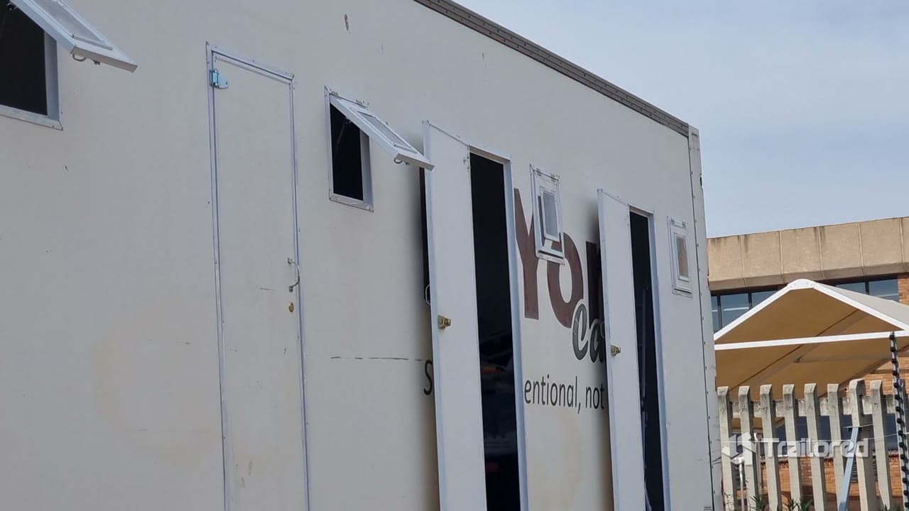 Exterior of the trailer showing the new doors and awning windows fitted along the side