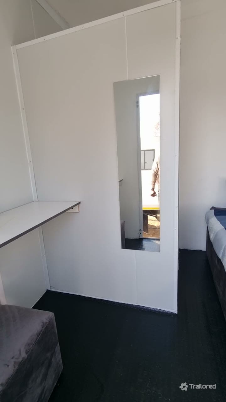 Walkthrough of the finished mobile film studio interior — dressing rooms with vanities and mirrors, rest berths and an en-suite bathroom