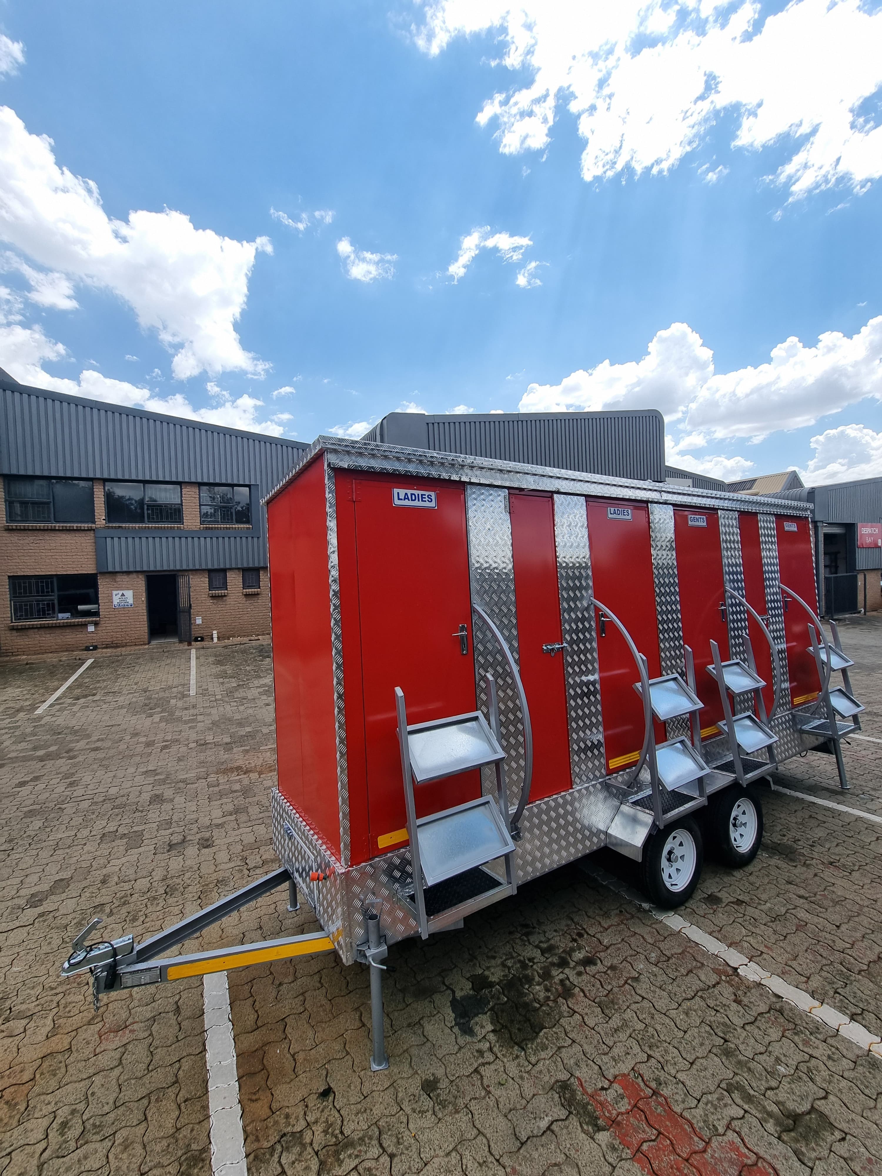 Trailored VIP toilet trailer parked at an outdoor venue