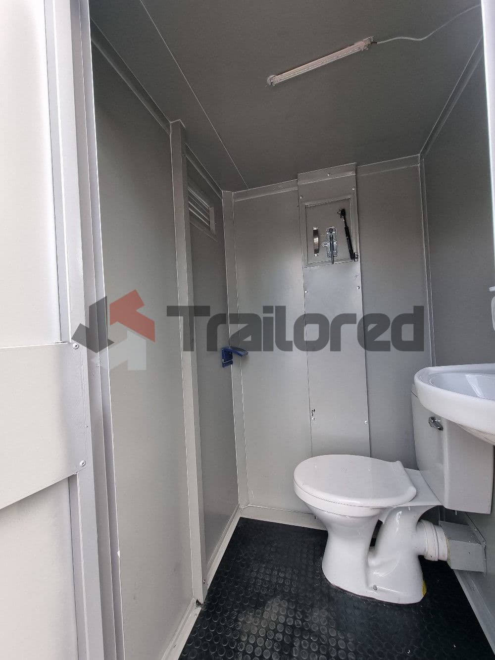 Chromadek two-stall VIP toilet trailer, step and door detail