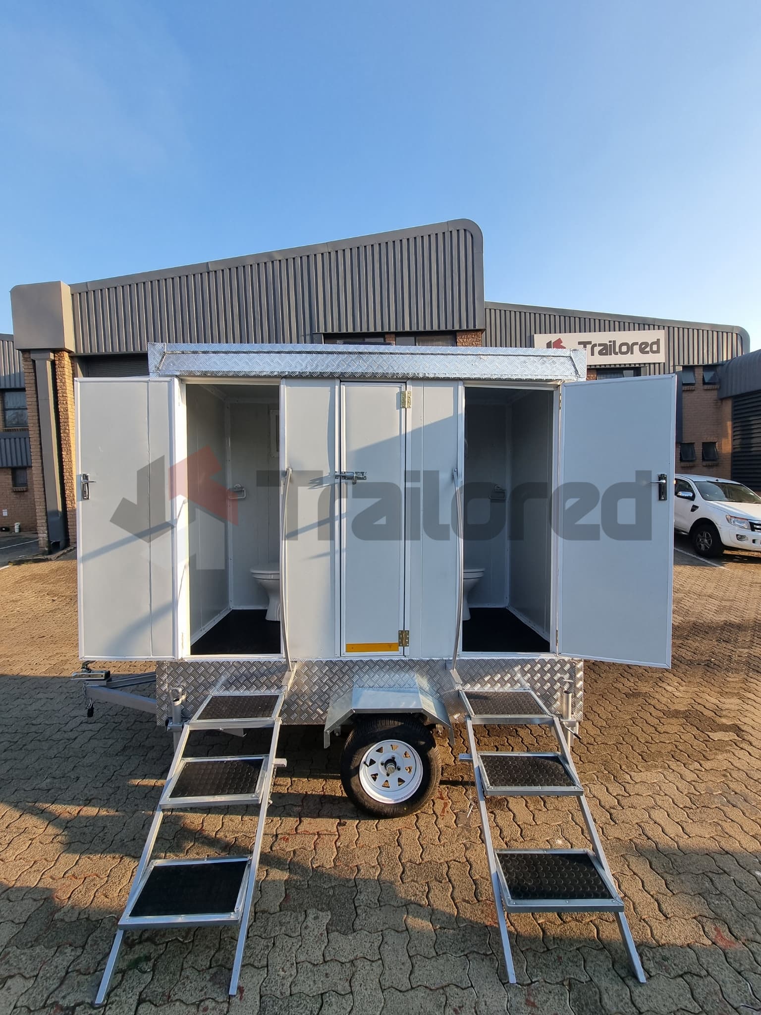 Premium two-stall VIP toilet trailer, sink and mirror detail