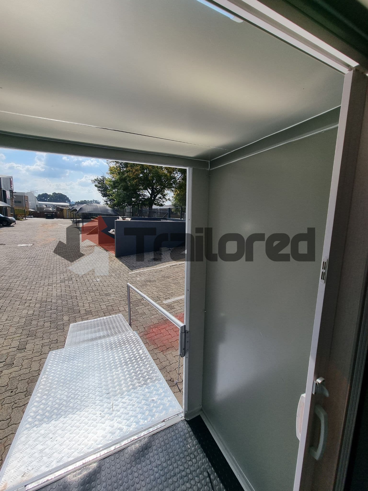 Accessible VIP toilet trailer with ramp deployed