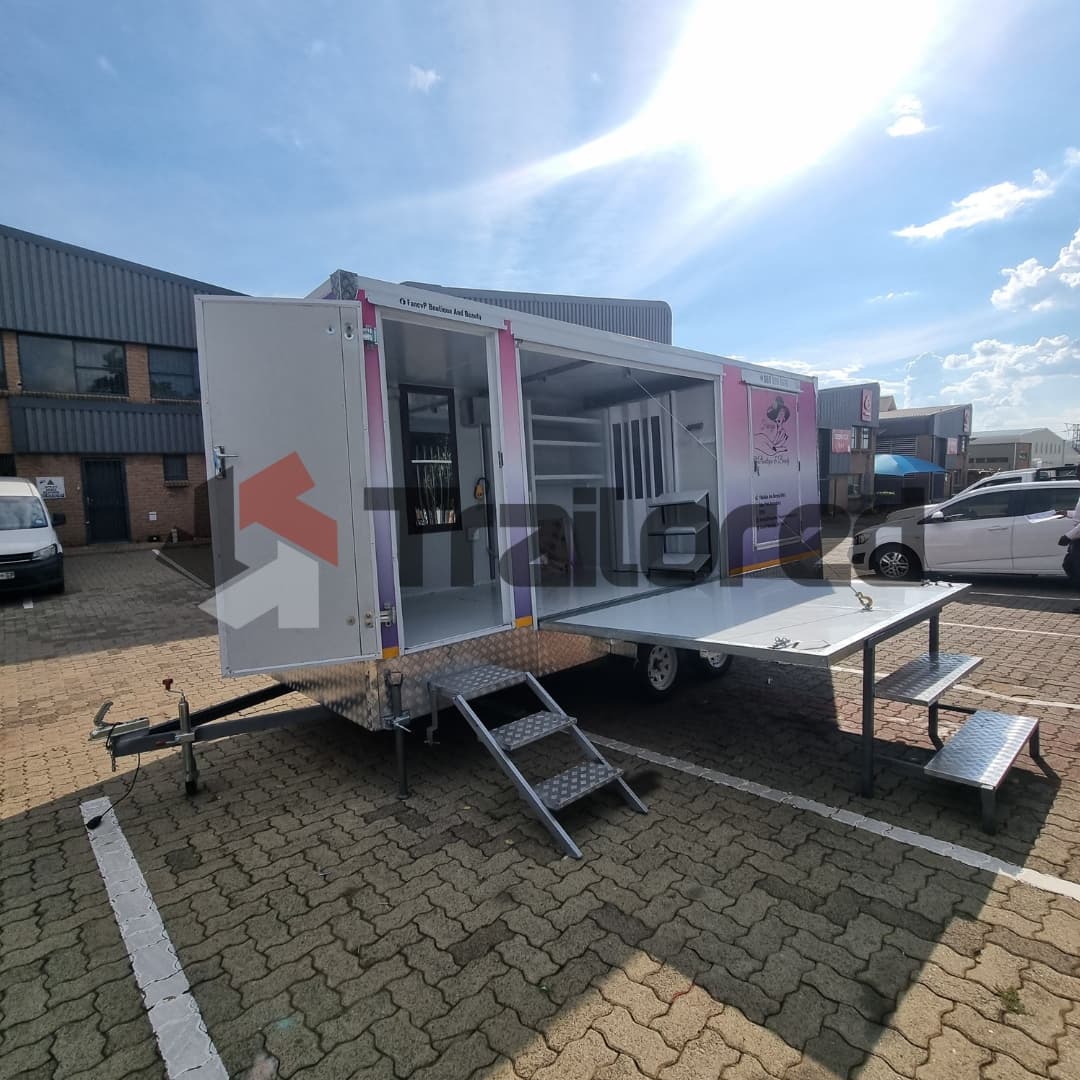 Specialty mobile stage trailer deployed outdoors