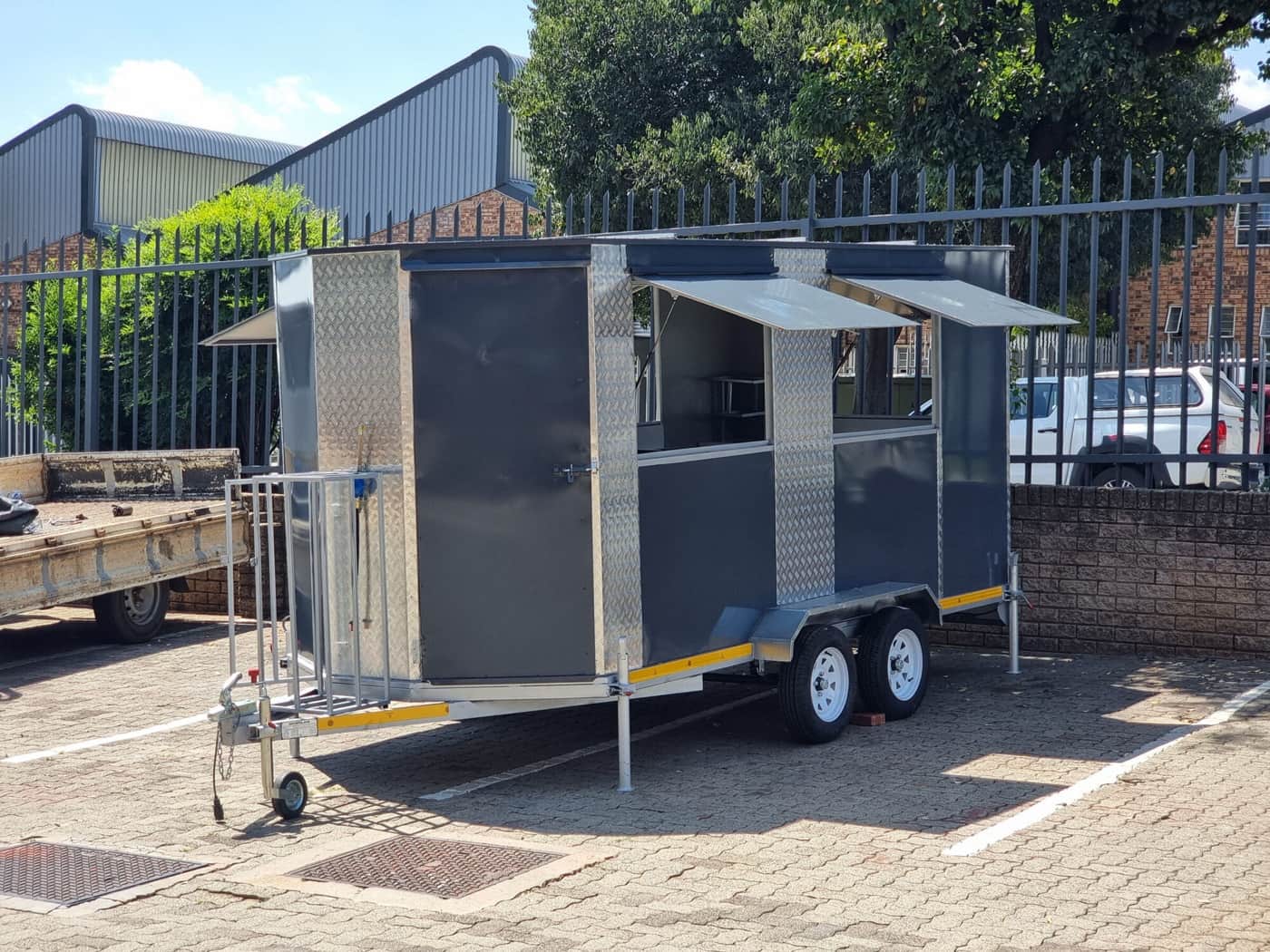 Mobile kitchen trailer serving customers